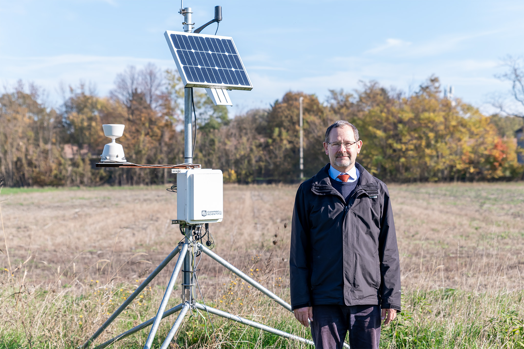 Dr Attila Kovács, a researcher at Széchenyi István University, with one of the sensors installed by the Albert Kázmér Faculty in Mosonmagyaróvár. (Photo: András Adorján)